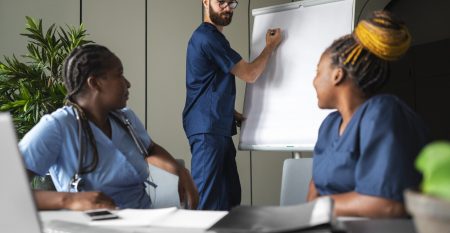 side-view-nurses-studying-together