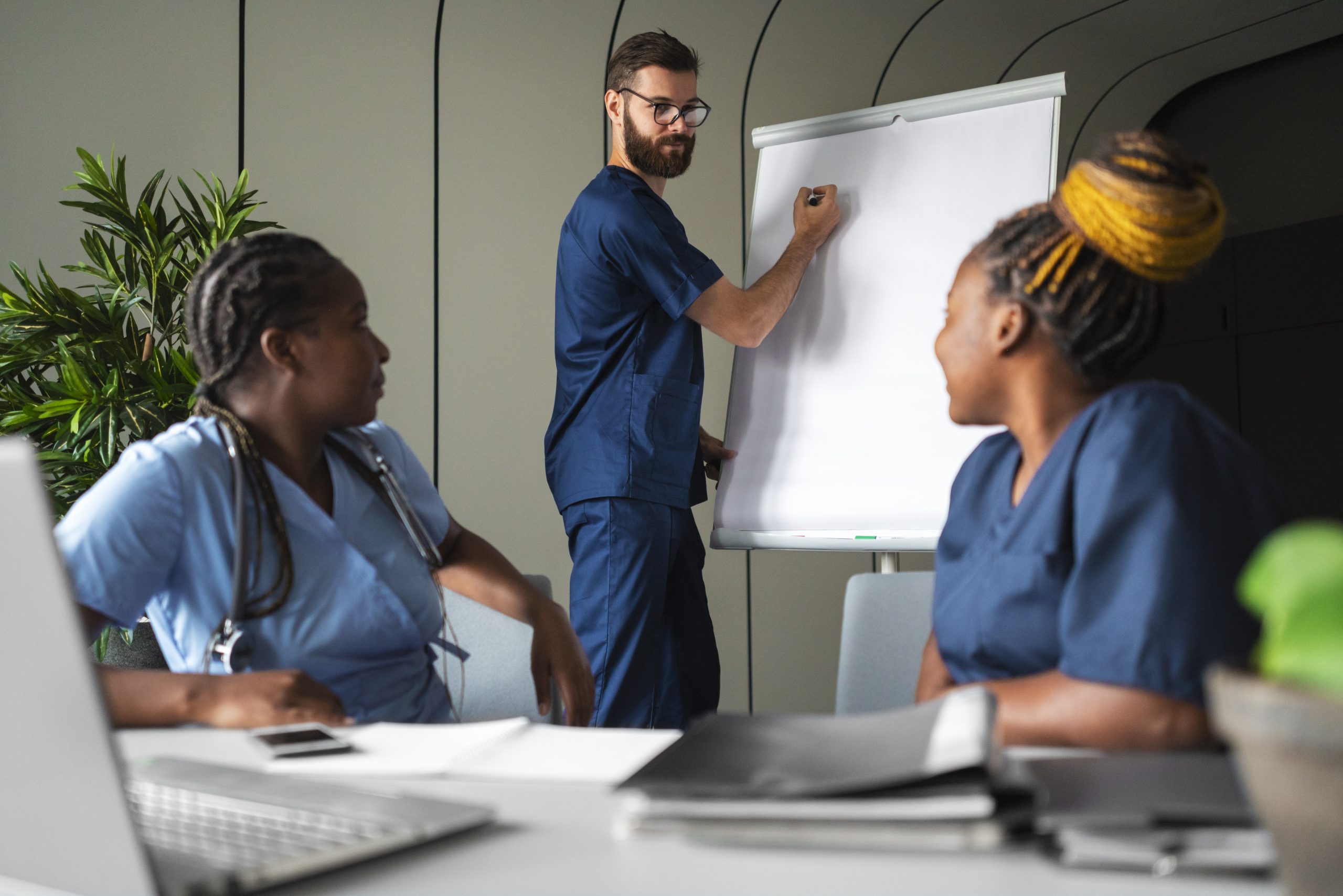 side-view-nurses-studying-together